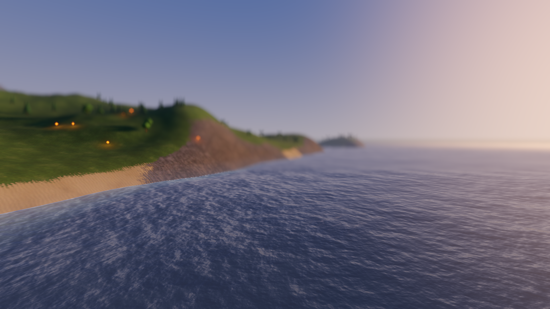 Open World — a golden-hour coastline of grassy hills, sandy shore and distant mountains